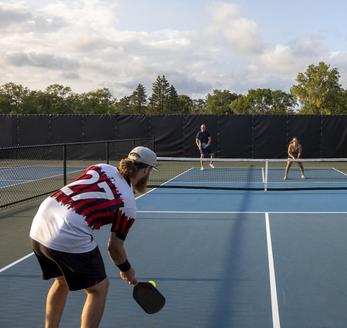 Two people playing pickleball with Teko yerba mate—natural energy and hydration from plant-based yerba mate blends