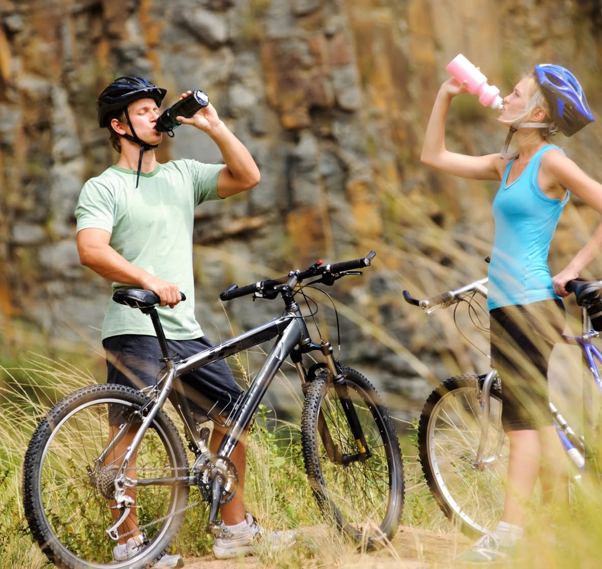 Two cyclists drinking Teko yerba mate from bottles—plant-based hydration and clean energy for active, outdoor lifestyles