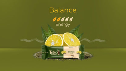 Teko Yerba Mate Powder Lemon flavor energy bar with fresh lemon slices and green leaves on olive background